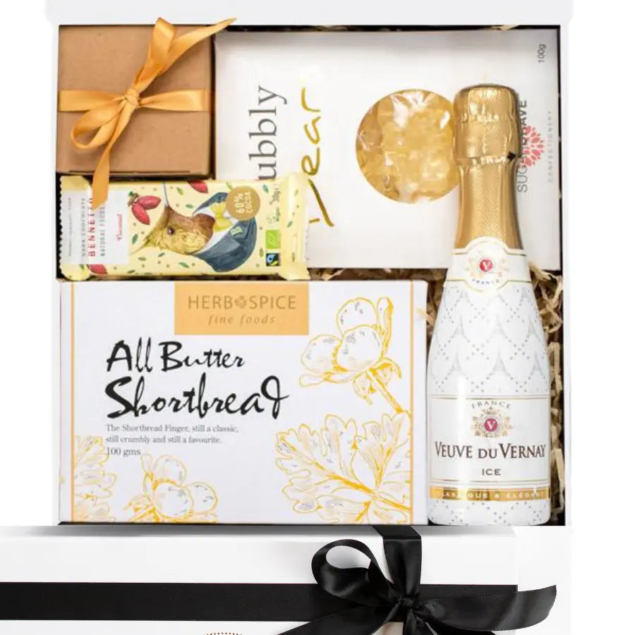 Gift set with Veuve du Vernay ice champagne, Herb & Spice shortbread, and a box of chocolates.