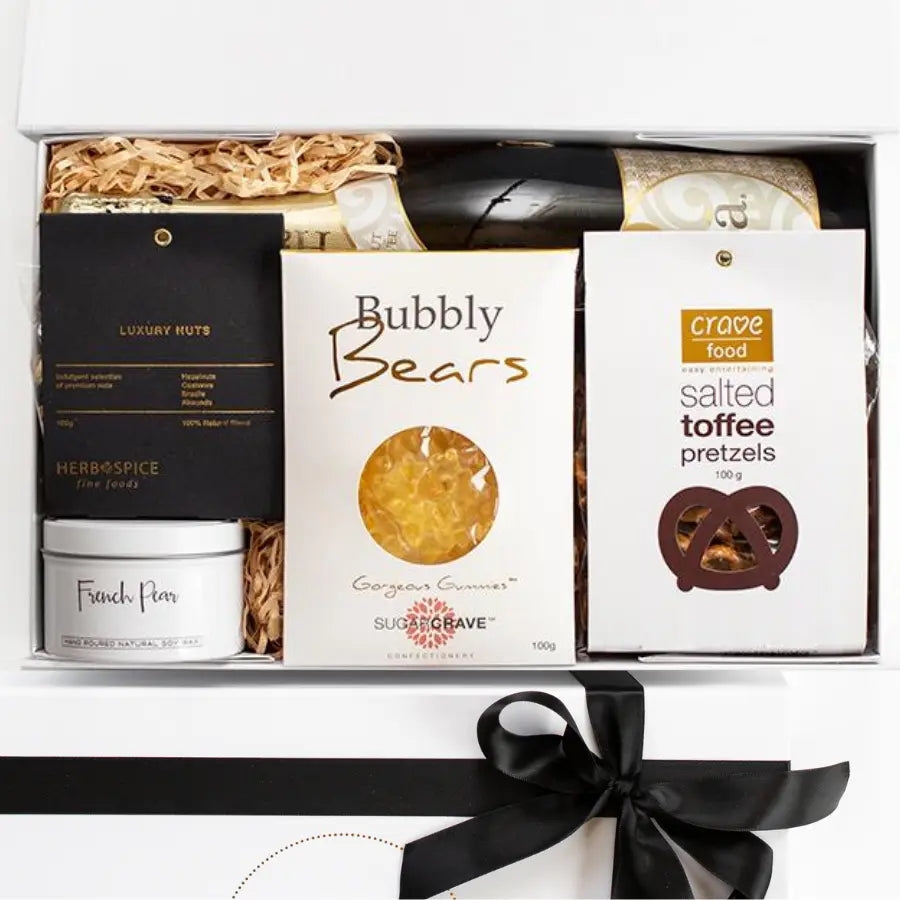 Gift box with snacks and a bottle of wine on a white background