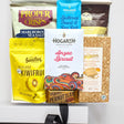 Assorted snack items including crisps, chocolate bars, and cookies on a white background