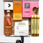 Gift set with drinks, snacks, and confectionery on a white background