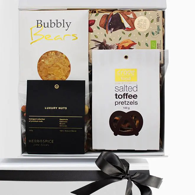 Gift set with 'Bubbly Bears' and 'Luxury Nuts' packaging, featuring a black ribbon on a white background.