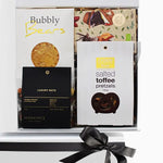 Gift set with 'Bubbly Bears' and 'Luxury Nuts' packaging, featuring a black ribbon on a white background.