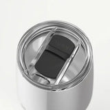 Silver tumbler with a black lid on a white background