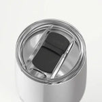 Silver tumbler with a black lid on a white background
