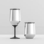 Two stainless steel tumblers with black stems on a light gray background